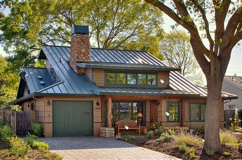 brown house with green metal roof|matching paint to green roof.